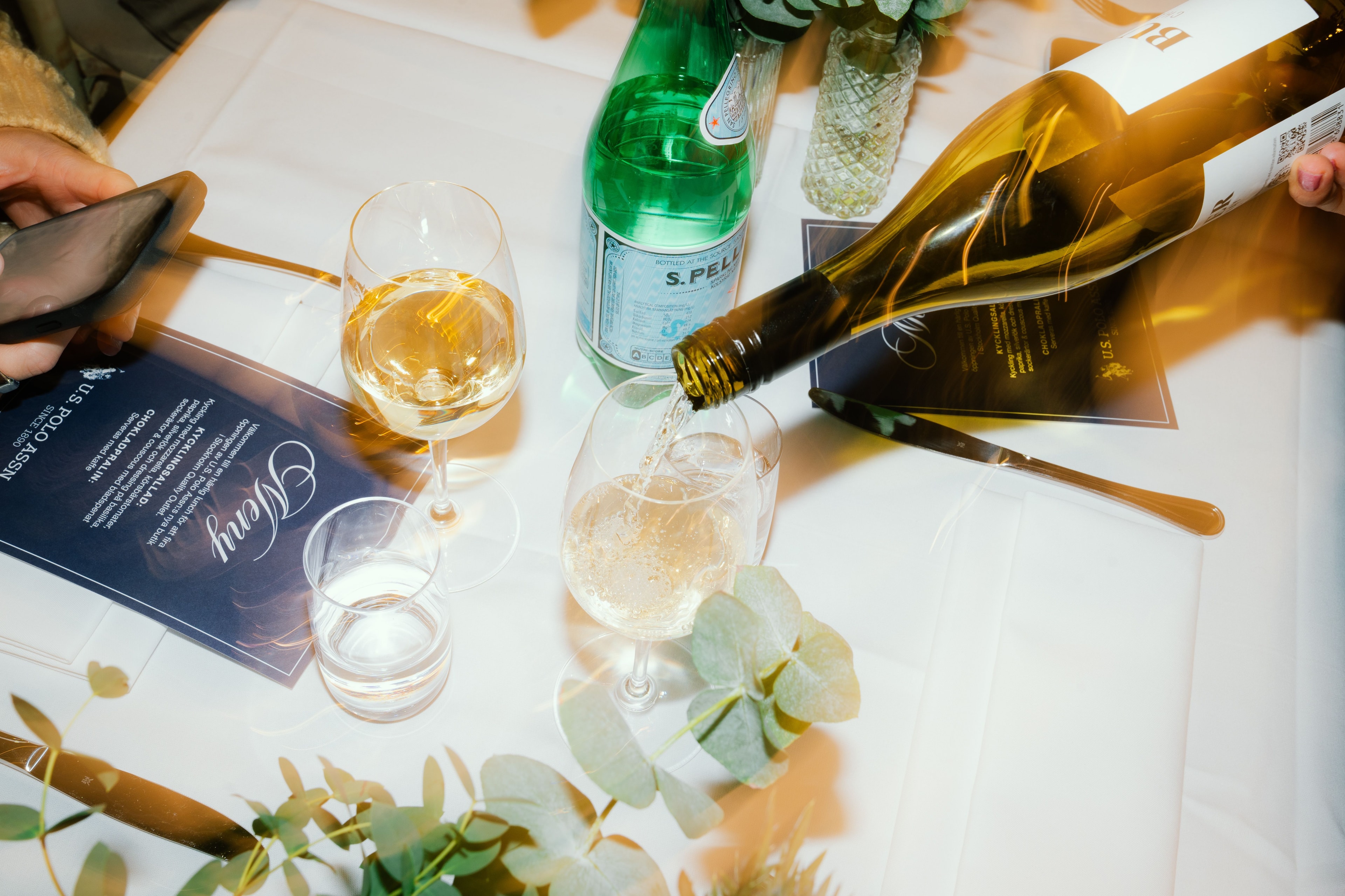 Wine being poured at the VIP Day dinner table