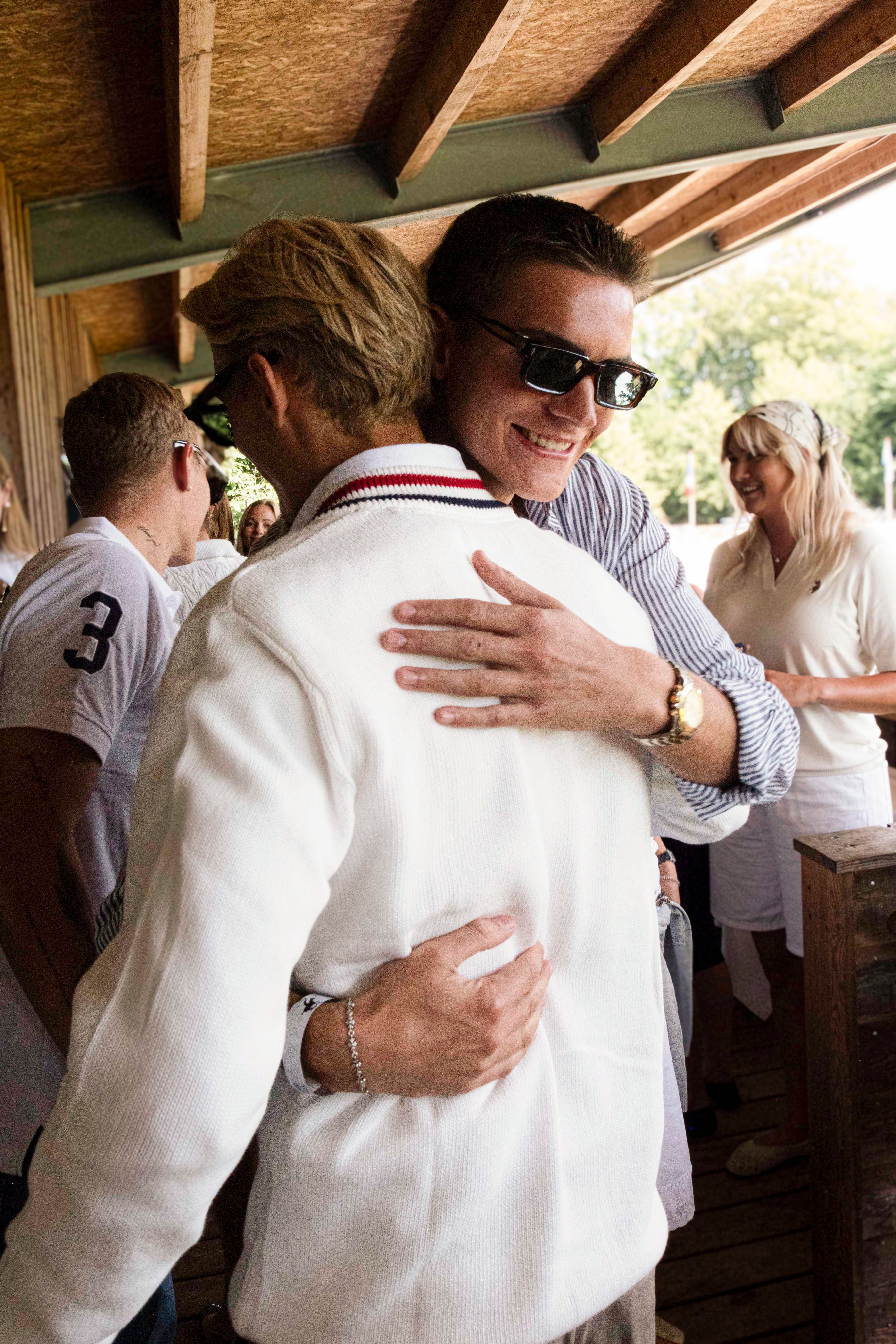 Guests embracing at the U.S. Polo Assn. VIP Day
